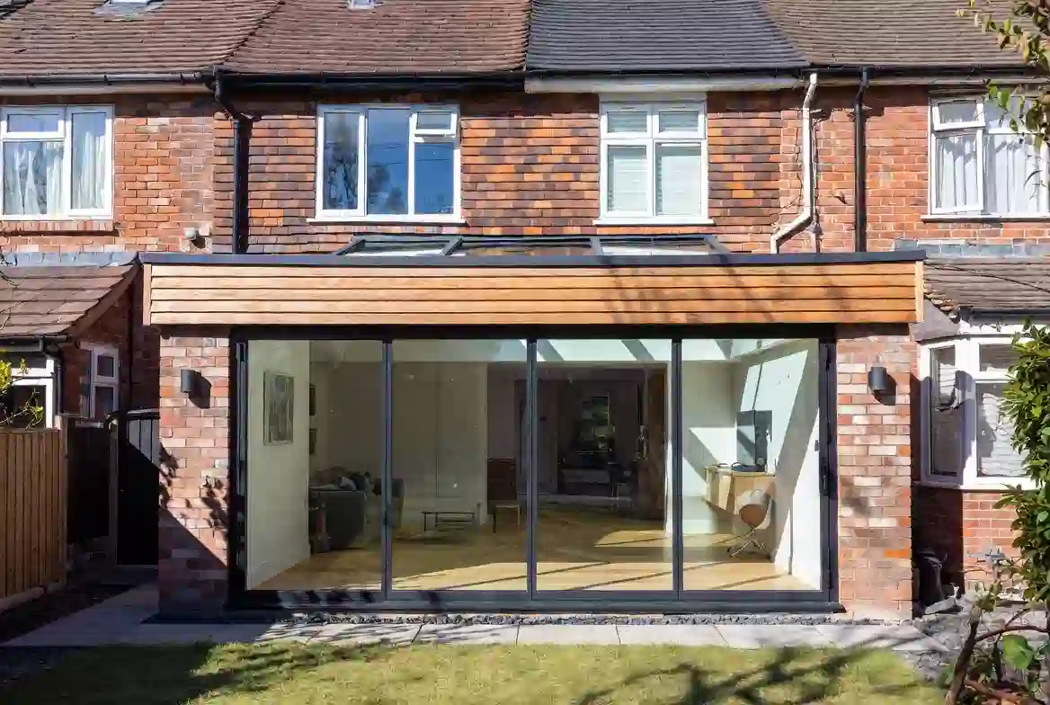 L-shaped wrap-around extension with bi-fold doors and lantern roof in Altrincham