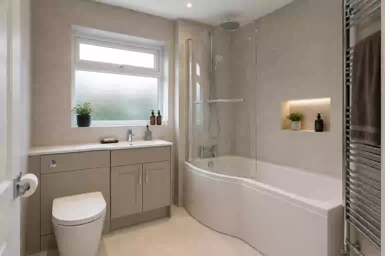 Family bathroom rebuild with P-shaped shower bath and ceramic tiling in Sale, Manchester
