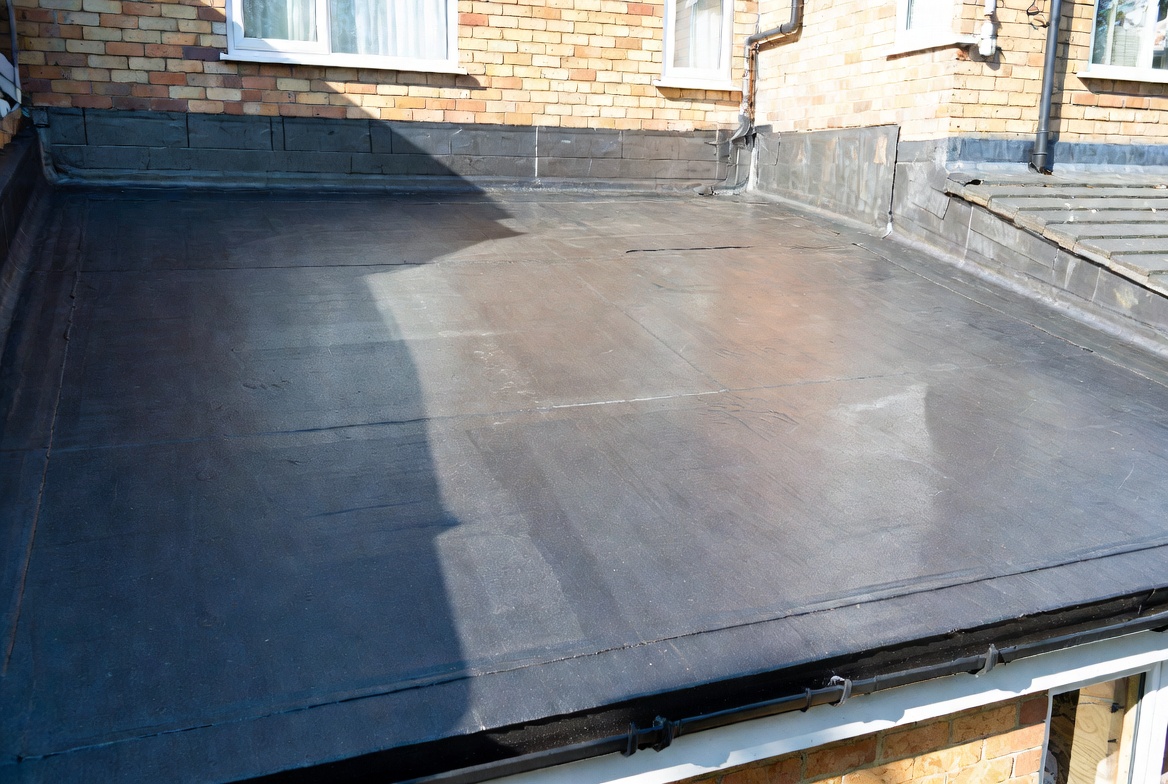 Firestone EPDM rubber flat roof replacement on a single-storey rear extension in Worsley, Salford