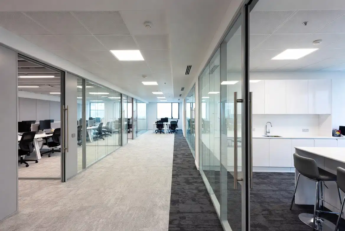 Modern open-plan office fit-out with glazed partitions in Stockport